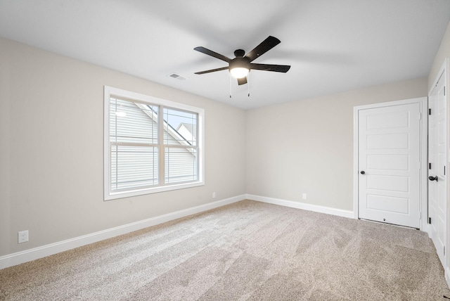 empty room with carpet and ceiling fan