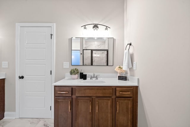 bathroom featuring walk in shower and vanity