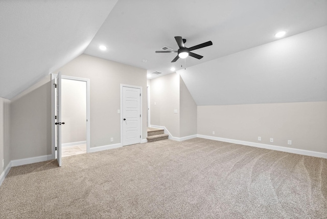 bonus room featuring lofted ceiling, carpet floors, and ceiling fan