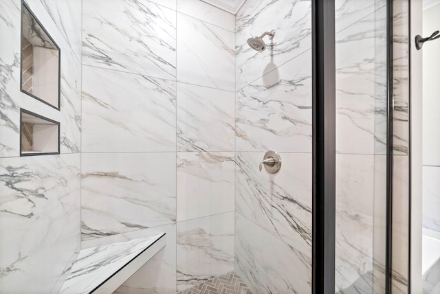 bathroom with a tile shower