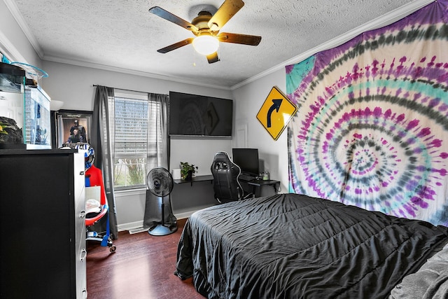 bedroom featuring ceiling fan, dark wood-type flooring, ornamental molding, and a textured ceiling