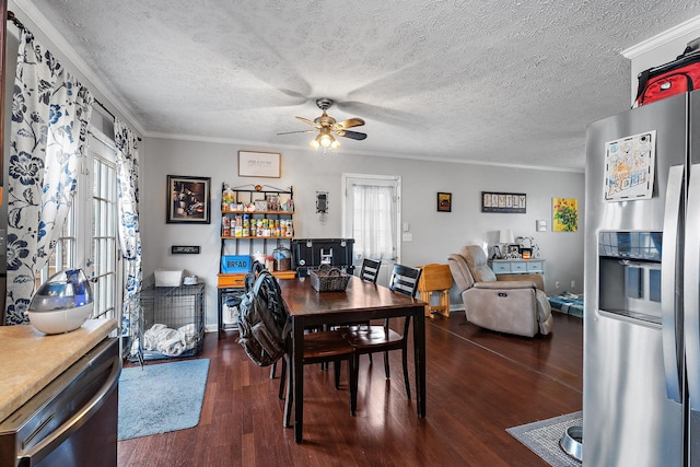 dining space with ceiling fan, ornamental molding, dark hardwood / wood-style floors, and a textured ceiling