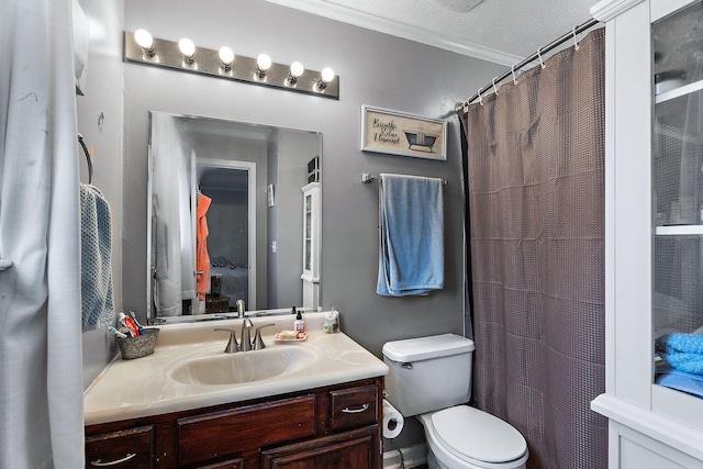 bathroom featuring vanity, crown molding, a textured ceiling, and toilet