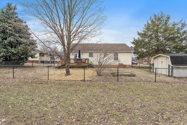 exterior space with a storage shed and a wooden deck