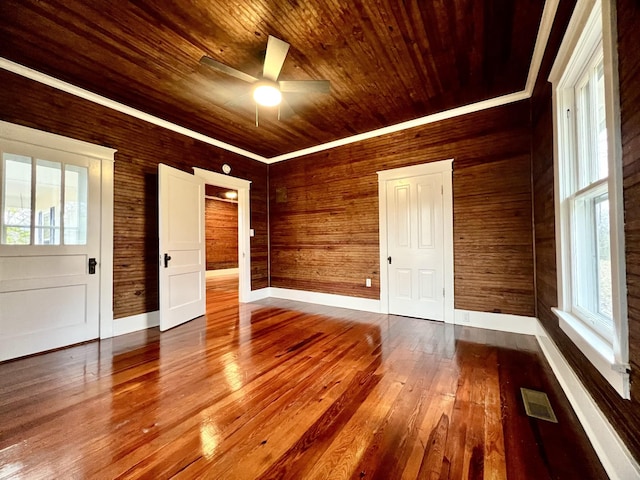 spare room with wood ceiling, ceiling fan, and wood-type flooring