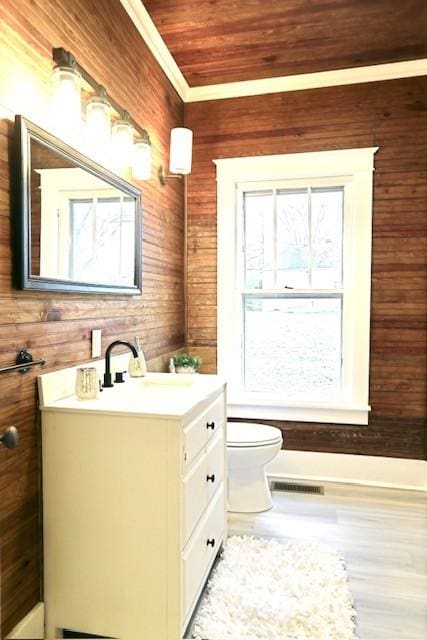 bathroom with wood ceiling, vanity, and a wealth of natural light