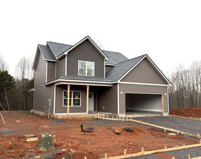 view of front of house with a garage and covered porch