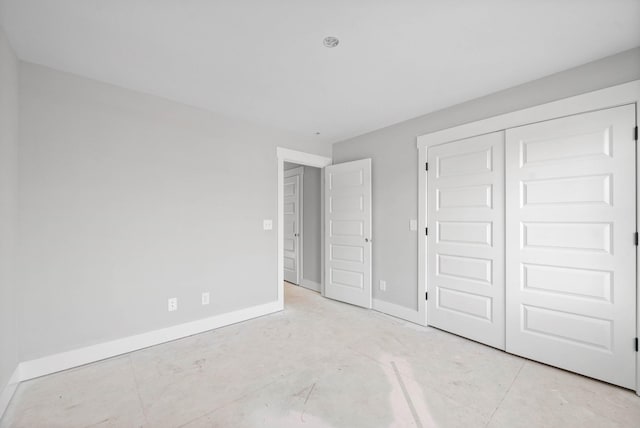 unfurnished bedroom with a closet