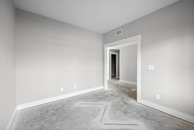 spare room featuring concrete flooring