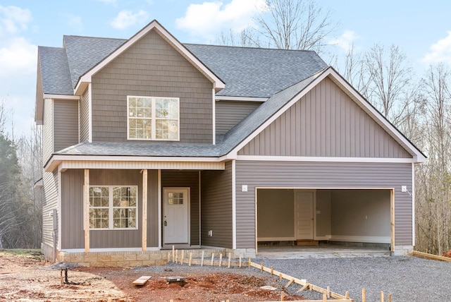 view of front of house featuring a garage and covered porch