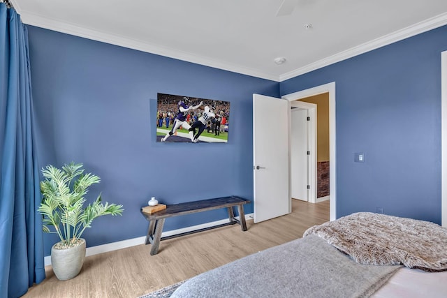 635 7th Ave S Unit 211, Nashville, TN 37203 - bedroom with wood finished floors, crown molding, and baseboards