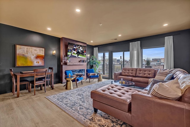 635 7th Ave S Unit 211, Nashville, TN 37203 - living area with recessed lighting and wood finished floors