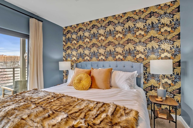 635 7th Ave S Unit 211, Nashville, TN 37203 - bedroom with baseboards and wallpapered walls