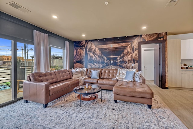 635 7th Ave S Unit 211, Nashville, TN 37203 - living area featuring light wood-style flooring and recessed lighting