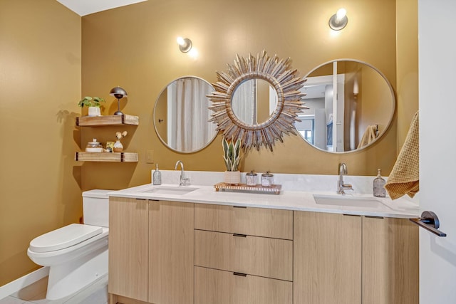 635 7th Ave S Unit 211, Nashville, TN 37203 - bathroom featuring toilet and double vanity