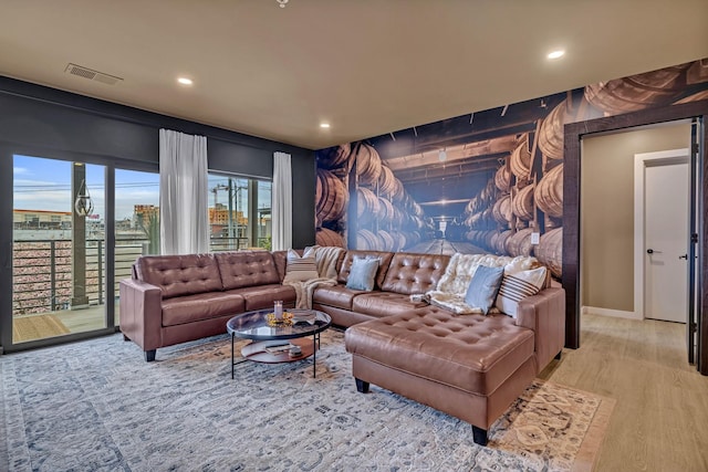 635 7th Ave S Unit 211, Nashville, TN 37203 - living room featuring recessed lighting, wood finished floors, and baseboards
