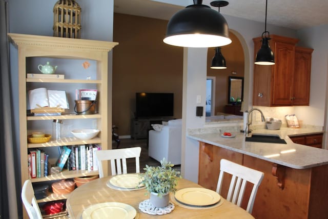 dining space with arched walkways