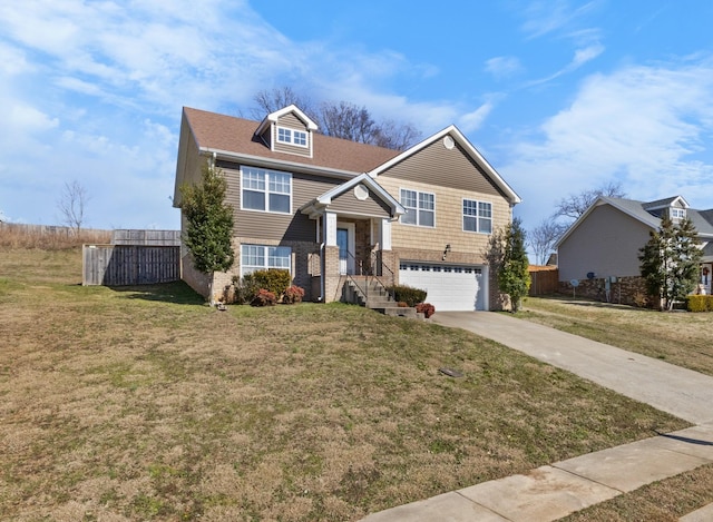 view of front of house featuring a garage and a front lawn