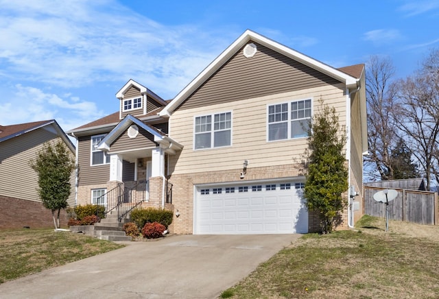 view of front of home with a garage and a front lawn