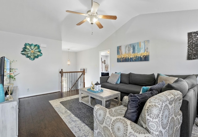 living room featuring vaulted ceiling, ceiling fan, and dark hardwood / wood-style flooring