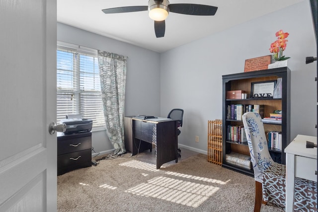 office with carpet floors and ceiling fan