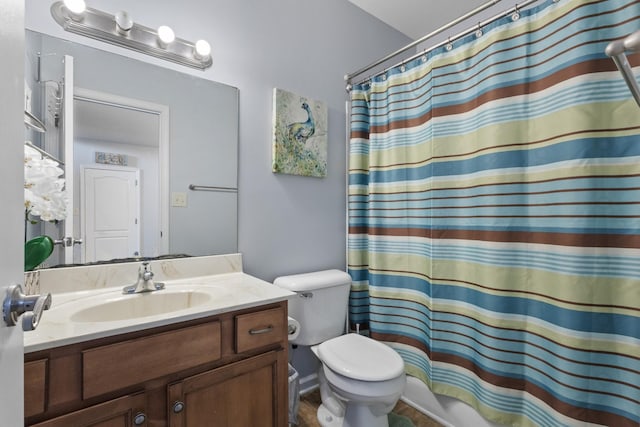 bathroom with vanity, toilet, and a shower with shower curtain