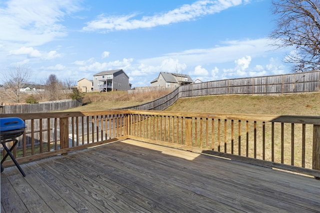 wooden terrace with a yard