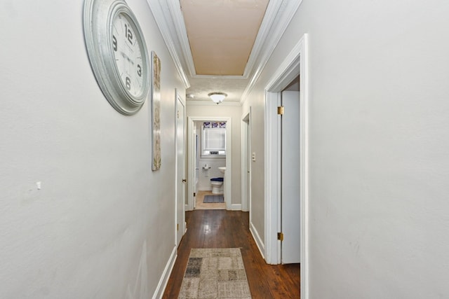 hall featuring crown molding and dark wood-type flooring