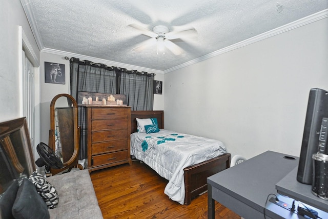 bedroom featuring ceiling fan, ornamental molding, dark hardwood / wood-style flooring, and a textured ceiling