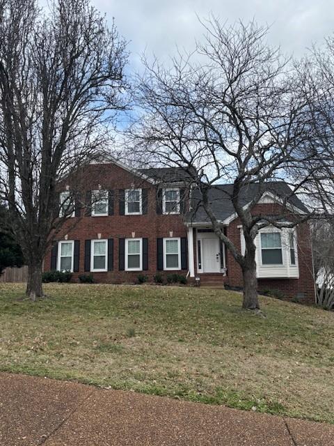 colonial house with a front yard