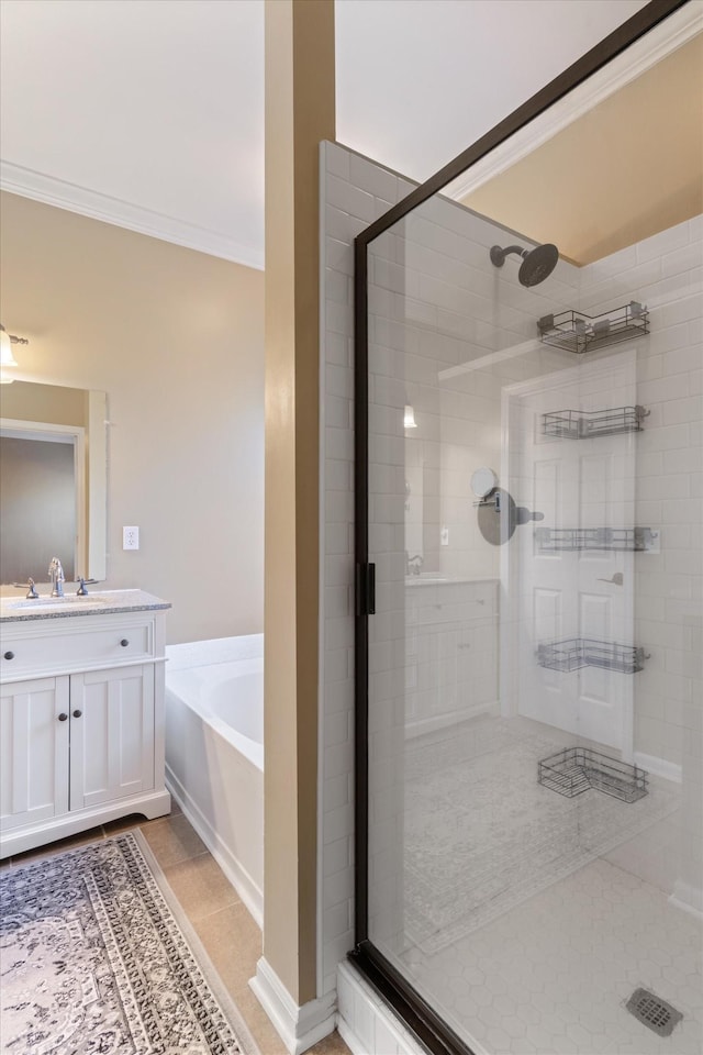 bathroom featuring shower with separate bathtub, tile patterned flooring, and ornamental molding