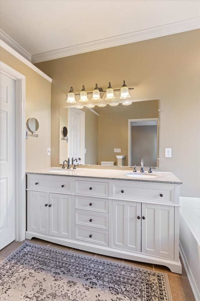 bathroom featuring a bathing tub, vanity, and ornamental molding