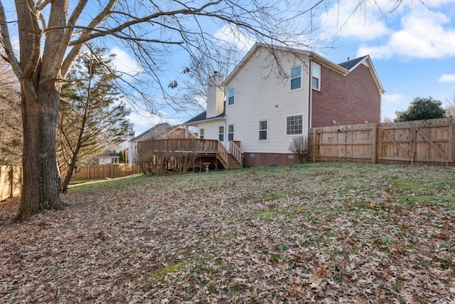 rear view of house featuring a deck