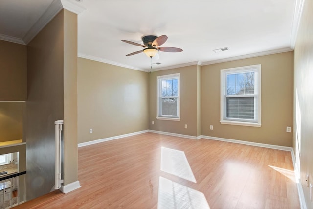 spare room with ceiling fan, crown molding, and light hardwood / wood-style floors