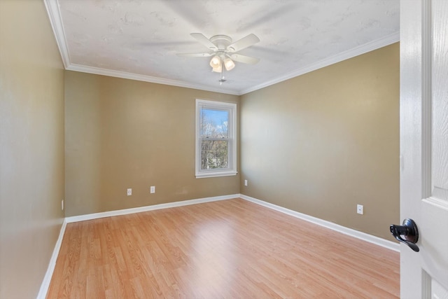 unfurnished room featuring light hardwood / wood-style flooring, ceiling fan, and ornamental molding