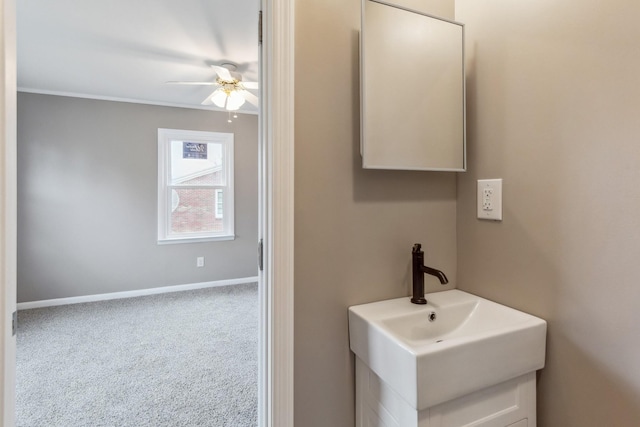 bathroom featuring ceiling fan and sink