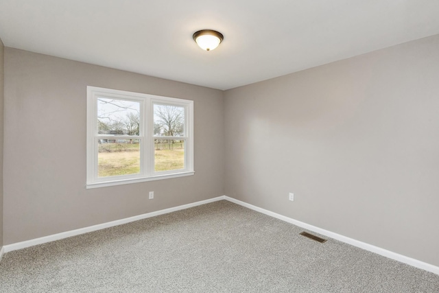 empty room featuring carpet flooring