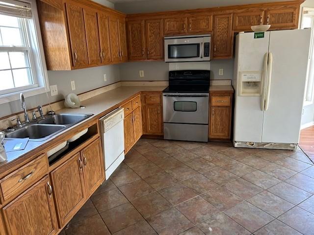 kitchen with sink and appliances with stainless steel finishes