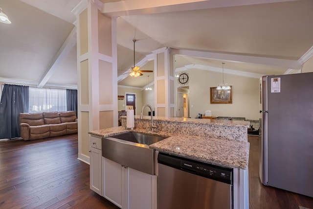 kitchen featuring white cabinetry, appliances with stainless steel finishes, sink, and light stone counters