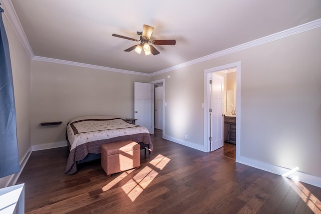 bedroom featuring crown molding, dark wood-type flooring, ceiling fan, and ensuite bathroom