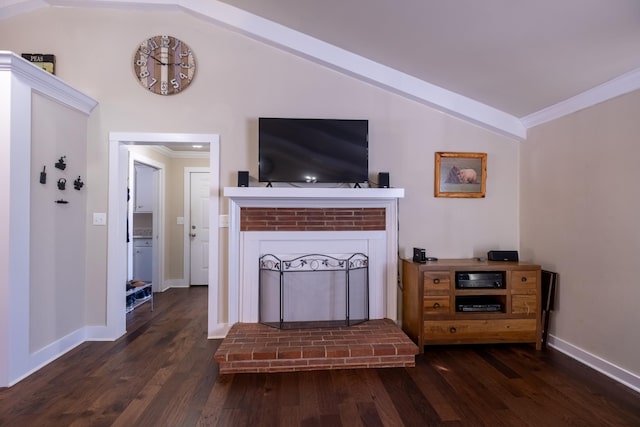 living room with lofted ceiling, a fireplace, crown molding, and dark hardwood / wood-style flooring