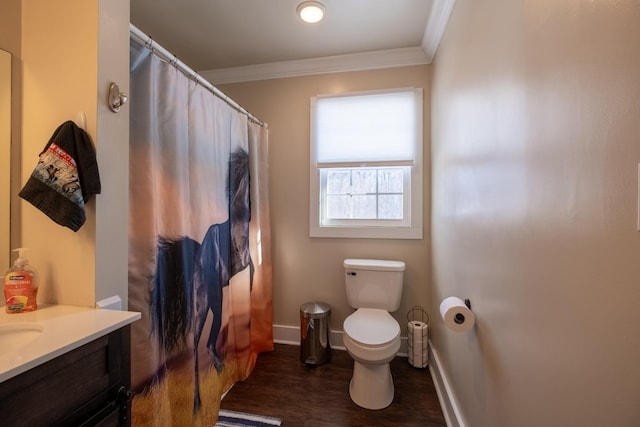 bathroom with hardwood / wood-style flooring, vanity, ornamental molding, toilet, and walk in shower