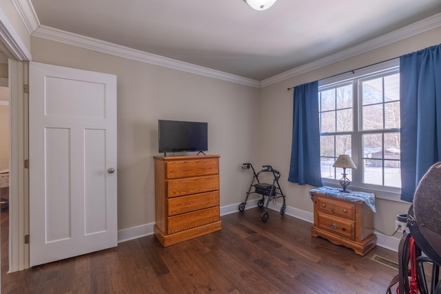 miscellaneous room featuring ornamental molding and dark wood-type flooring