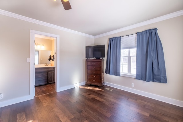 unfurnished bedroom with ornamental molding, ensuite bathroom, ceiling fan, and dark hardwood / wood-style flooring