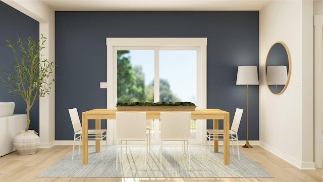 dining space featuring light wood-type flooring