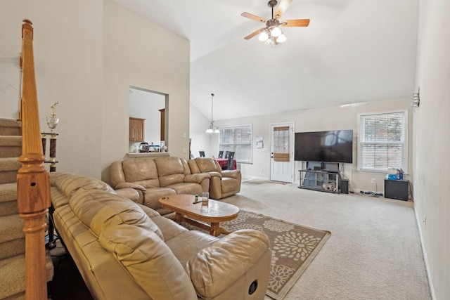 carpeted living room with high vaulted ceiling and ceiling fan