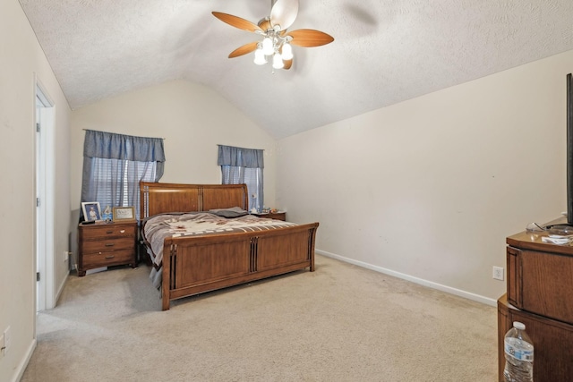 carpeted bedroom featuring ceiling fan, lofted ceiling, and a textured ceiling