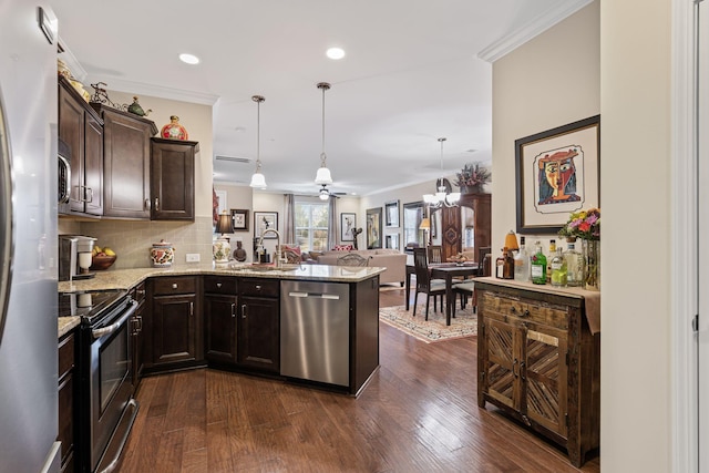 kitchen with dark brown cabinets, hanging light fixtures, ornamental molding, kitchen peninsula, and stainless steel appliances