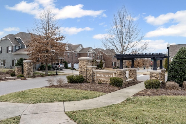 surrounding community with a yard and a pergola