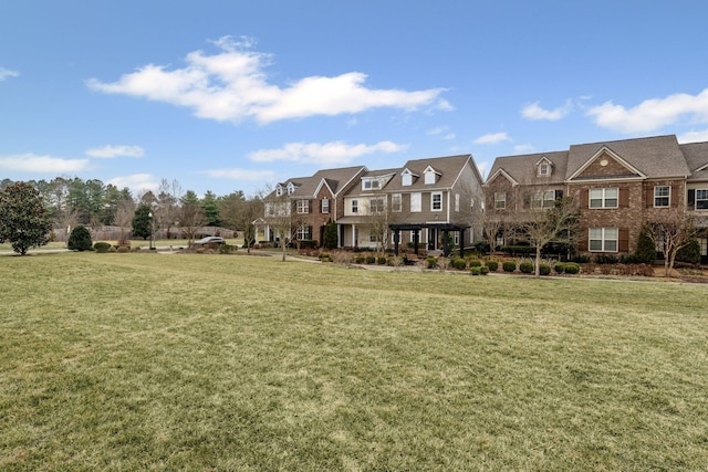 surrounding community featuring a yard and a pergola